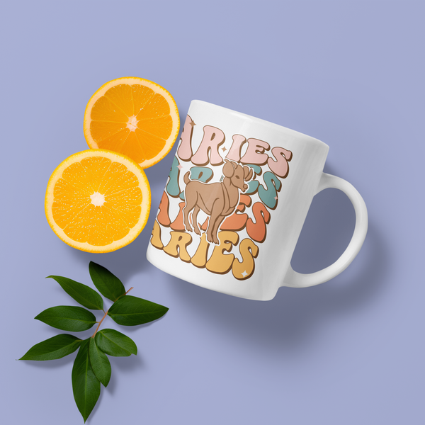 Mug AstroRétro Vintage Bélier placéà côté de tranches d'orange et d'amandes